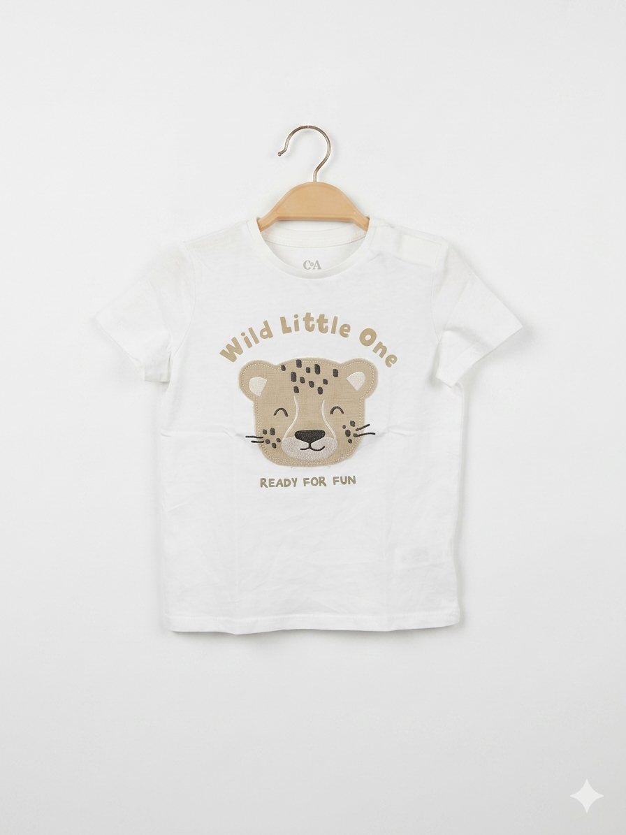 Looking for high-quality, sustainable toddler wear? This C&A Baby White Leopard T-shirt is a must-have for your child's wardrobe. Known for their durable and soft organic cotton fabrics, C&A provides comfort that lasts. This "Wild Little One" graphic tee is perfect for casual playdates or summer outings. Shop pre-loved and save on premium European brands at Tiny Thrift Store.