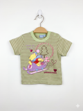 Front and back view of a light green striped Disney Baby t-shirt featuring Winnie the Pooh and Piglet on a sled. The shirt is displayed on a hanger against a Tiny Thrift Store background.