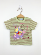 Front and back view of a light green striped Disney Baby t-shirt featuring Winnie the Pooh and Piglet on a sled. The shirt is displayed on a hanger against a Tiny Thrift Store background.