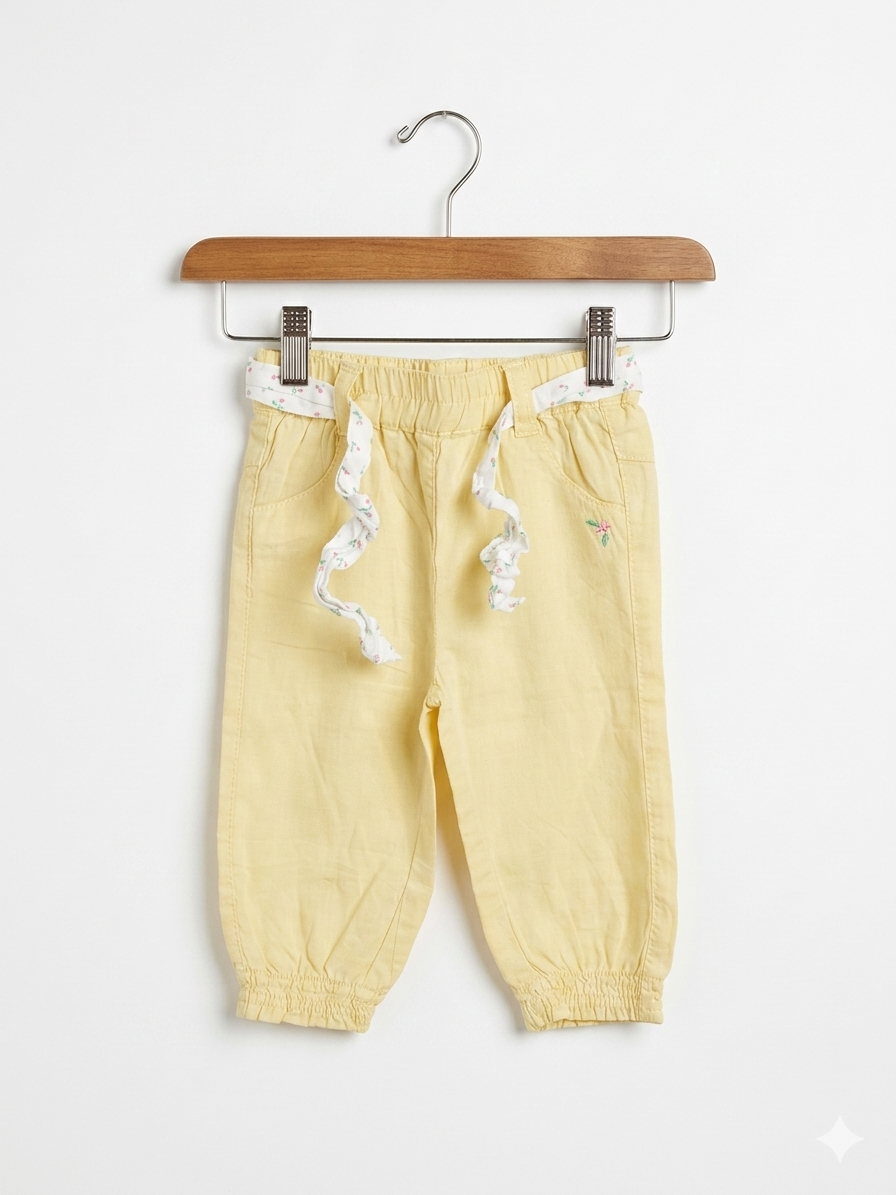 Zeeman baby clothes, yellow infant trousers, 6 months baby girl pants, Dutch baby brand, cotton baby bottoms, yellow pants with floral belt, Tiny Thrift Store kids, lightweight baby trousers.