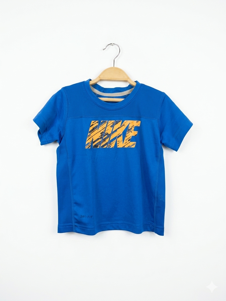 Shop the best in kids' sportswear with this Nike Dri-FIT Toddler T-shirt. This blue athletic tee is engineered for comfort, featuring Nike’s signature sweat-wicking fabric to keep your toddler cool and dry. The vibrant orange logo adds a pop of style to any outfit. Ideal for soccer practice, the playground, or casual wear. Authentic Nike quality at a fraction of the retail price, only at Tiny Thrift Store.