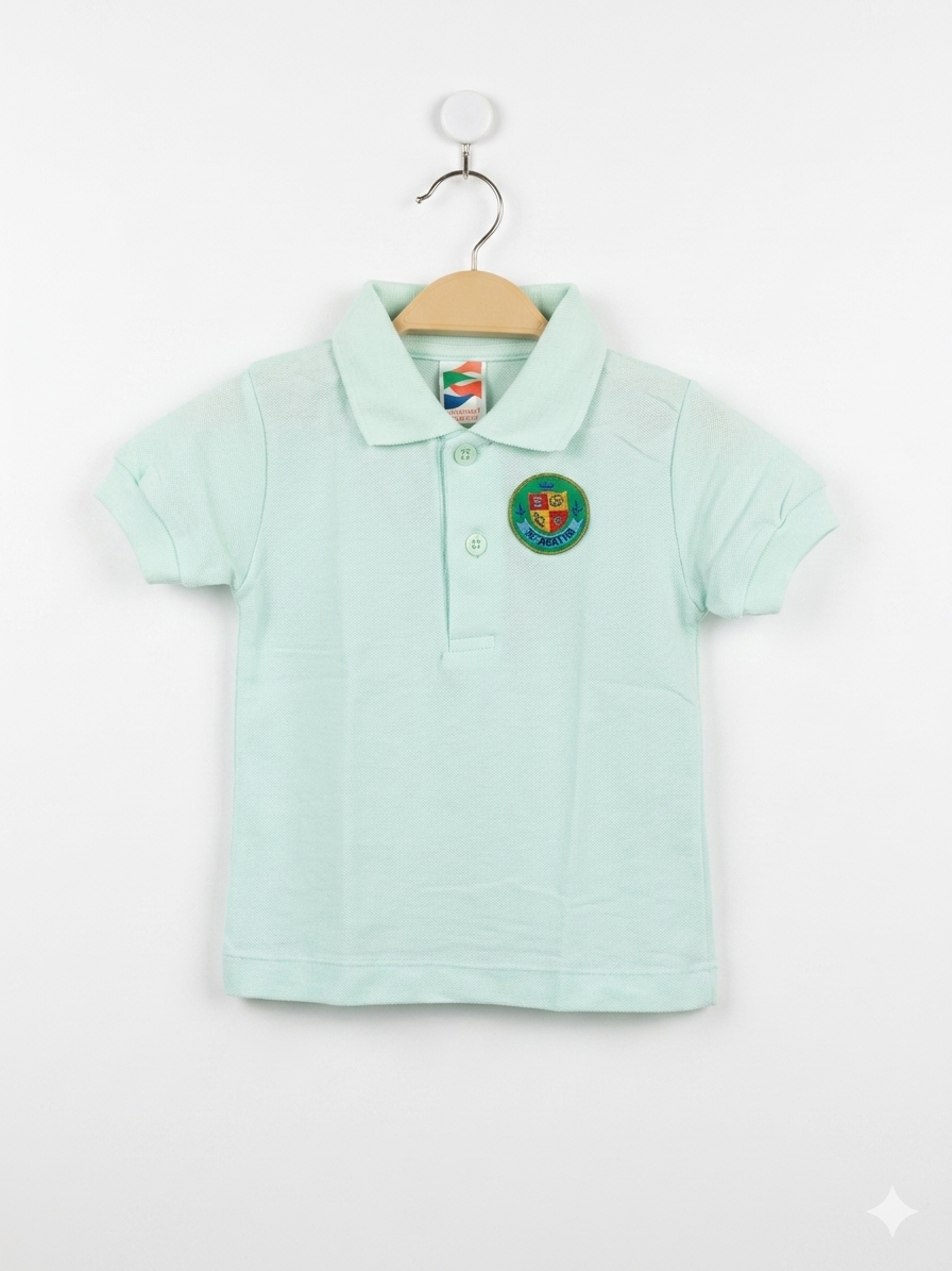 Front and back view of a children's pastel mint green short-sleeved polo shirt hanging on a wooden hanger. The shirt features a two-button collar and a colorful embroidered circular crest on the left chest with the word "STATE" and a shield. The fabric has a classic textured pique weave.