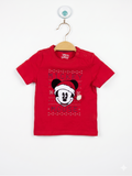 Front and back view of a red infant t-shirt featuring Mickey Mouse in a Santa hat with a white pom-pom. The shirt is displayed on a hanger in front of a Tiny Thrift Store backdrop.