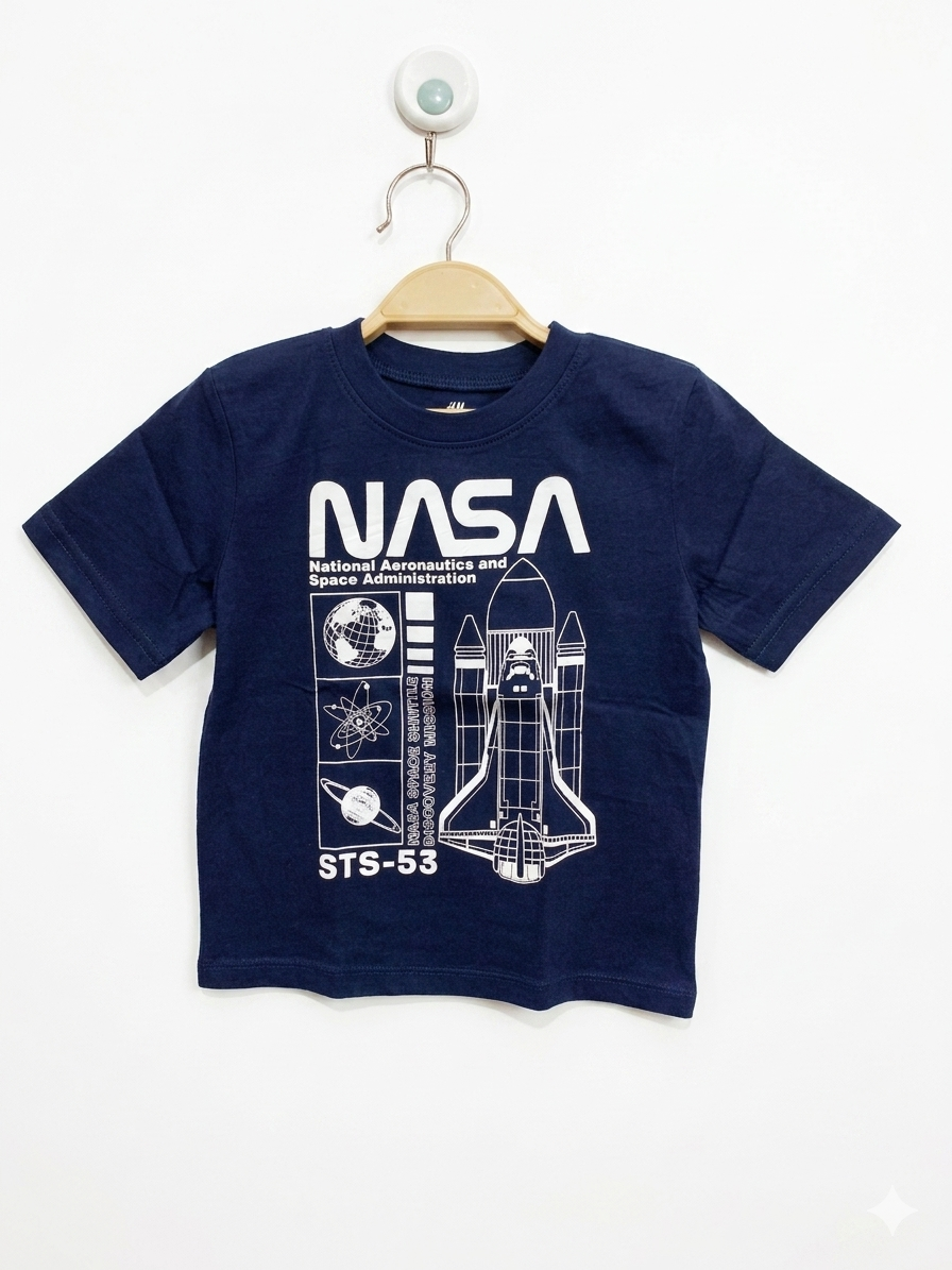 Front view of an H&M navy blue kids t-shirt with a white NASA Space Shuttle Discovery Mission graphic, hanging on a wooden-style hanger at Tiny Thrift Store.