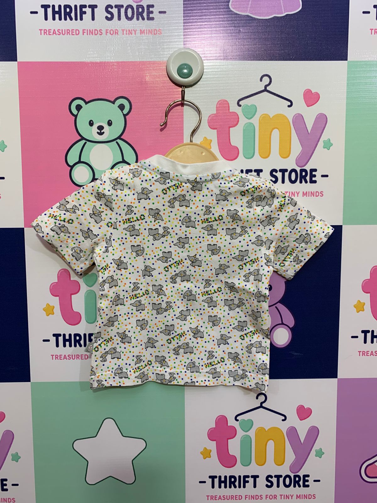 short-sleeved patterned white T-shirt. AB1