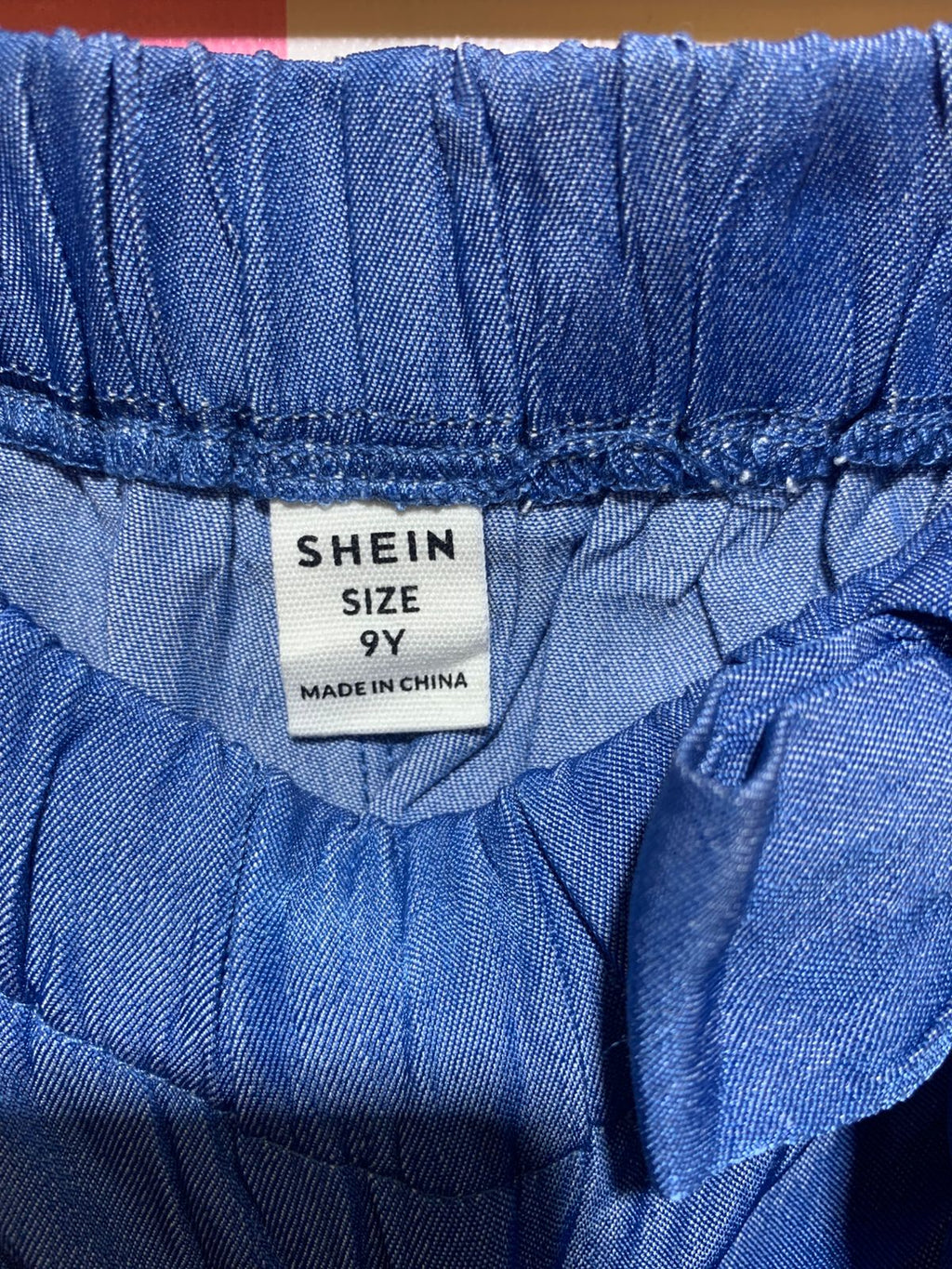 SHEIN Girls Medium Wash Chambray Ruffle Trim Shorts with Side Bow - Size Estimated Age 9 Years AB1
